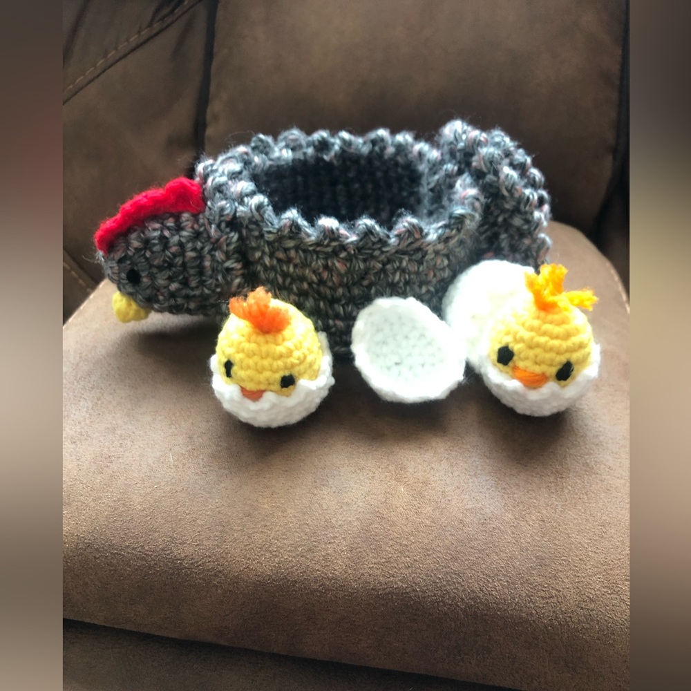 Crocheted chicken with baby chicks